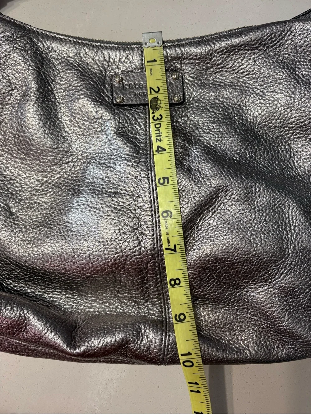 Kate Spade Janaya shiny silver hobo bag